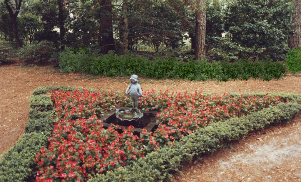 Formal garden parterre with statue